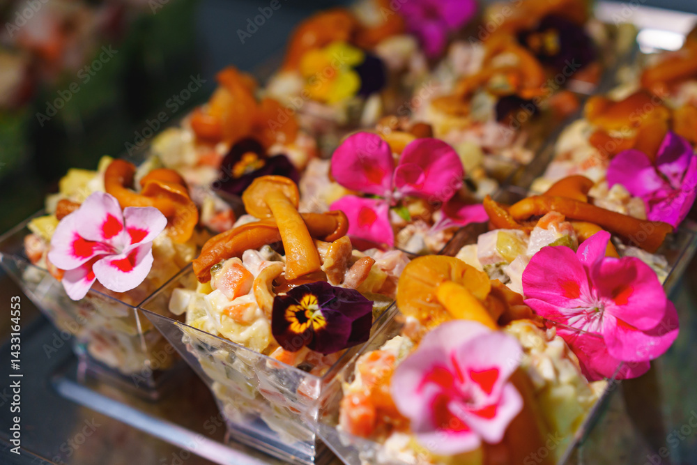 tartlets with pate and salad garnished with flowers. Delicious appetizers.