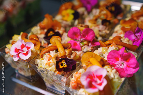 Obraz na płótnie tartlets with pate and salad garnished with flowers. Delicious appetizers. w salonie