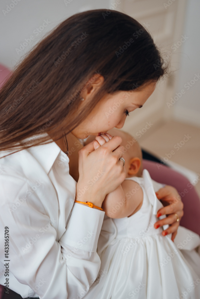 Mom feeds baby daughter with breast milk.