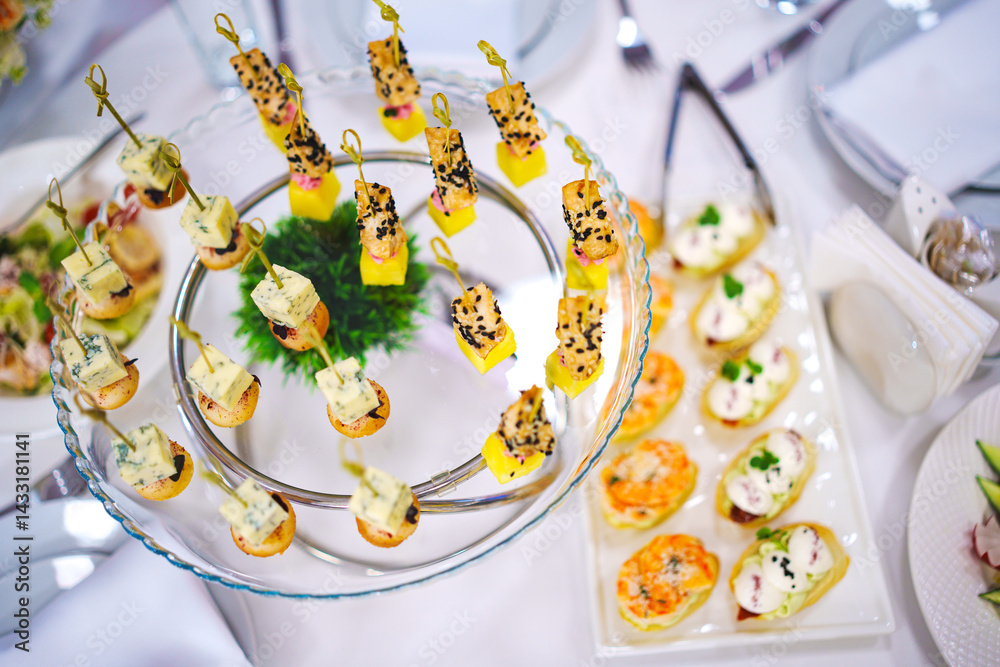Assorted canapes for the festive table. Catering services for banquets.