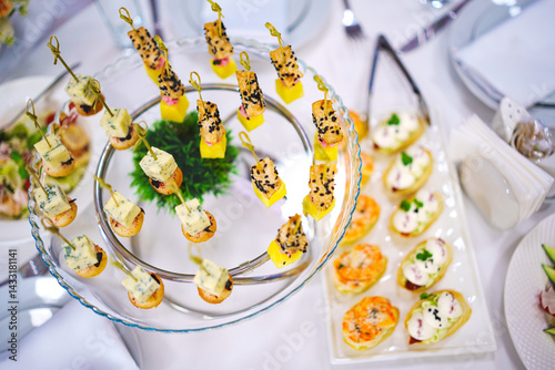 Obraz na płótnie Assorted canapes for the festive table. Catering services for banquets. w salonie