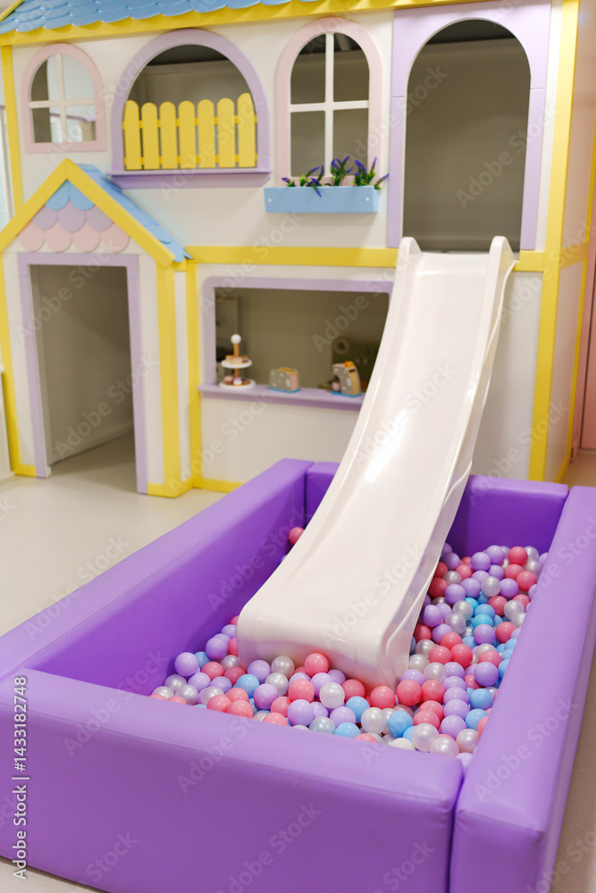 A children's slide with a dry ball pool for a children's center.