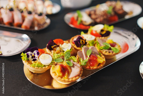 Obraz na płótnie tartlets with pate and salad garnished with flowers. Delicious appetizers. w salonie