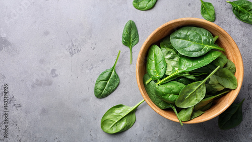 fresh spinach leaves on gray concrete background