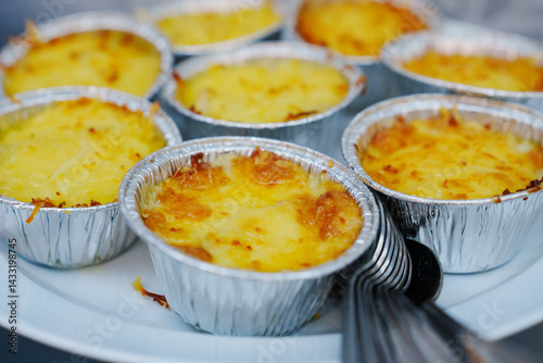 Obraz na płótnie julienne with mushrooms and cheese in disposable molds for a buffet. w salonie