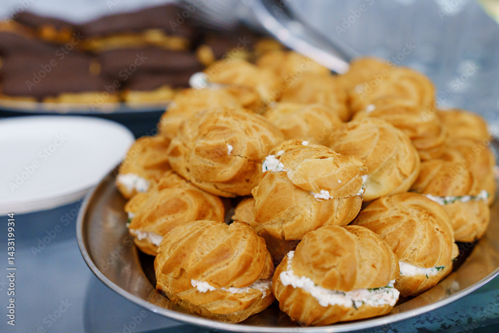 Plate with profiteroles stuffed with pate.