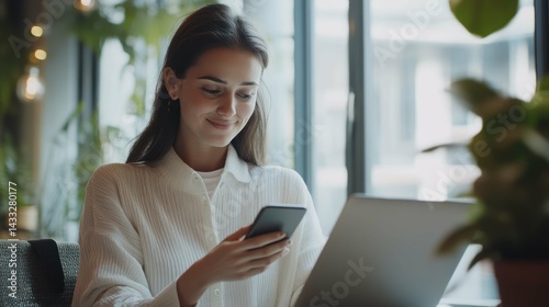 Young woman uses smartphone, engages modern technology, connecting, browsing, enjoying digital communication, lifestyle.