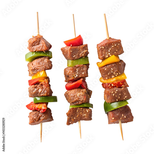  three wooden skewers of marinated meat kebabs, arranged in a triangular formation on a plain white background. 