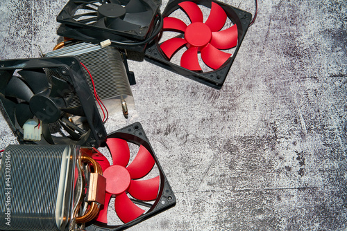 From above of vintage red CPU cooler also called PC cooling fan placed on surface