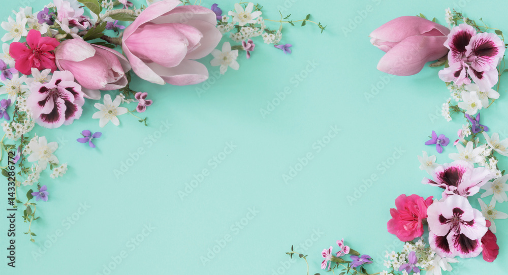 pink and white spring flowers on green background