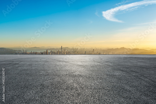 Fototapeta Naklejka Na Ścianę i Meble -  Asphalt road platform and city skyline with modern buildings at sunset in Shenzhen