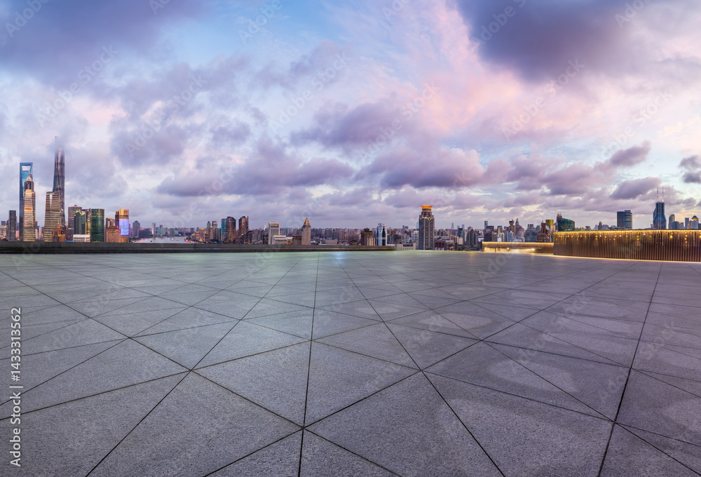 Empty square floor and city skyline with modern buildings at dusk in Shanghai