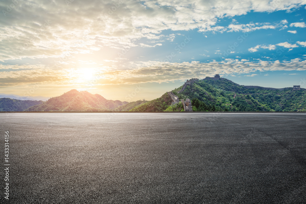 View of the great wall of china at sunset from asphalt road