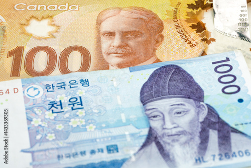 Wallpaper Mural 100 Canadian dollar and 10000 South Korean won banknotes. International trade concept Torontodigital.ca