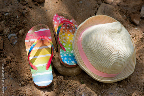 Summer vacation concept: flip-flops and strawn hat. summer in the village. High quality photo