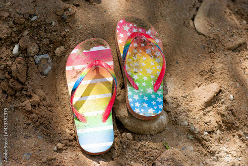 Summer vacation concept: flip-flops and strawn hat. summer in the village. High quality photo