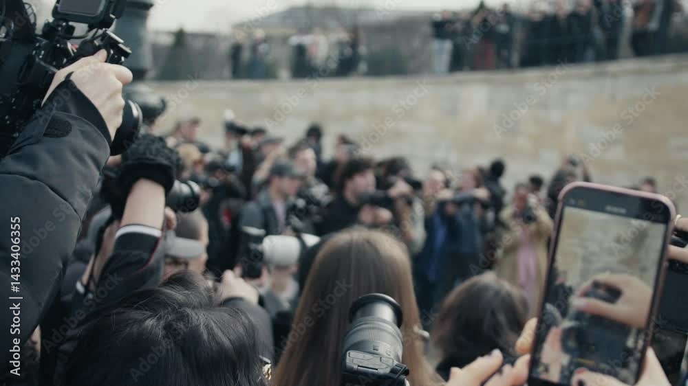 Paparazzi and journalists recording a celebrity interview