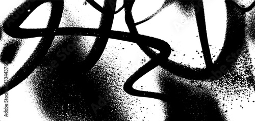 Graffiti spray overlay creating a textured grunge background in black and white with abstract patterns and intricate designs