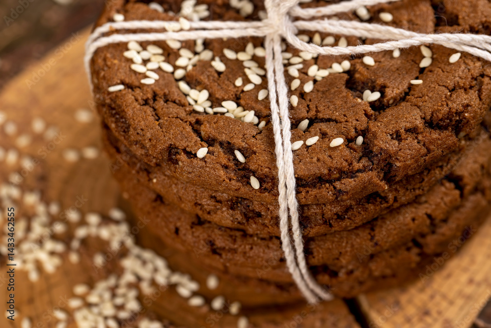 biscuits with real cocoa and sesame, close up, cookies are tied with rope