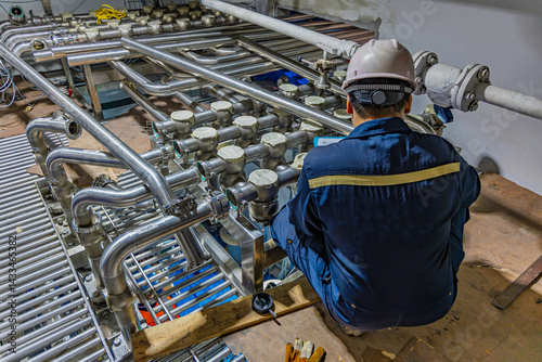 Male work inspection process stainless steel pipe stainless with pressure meter in equipment tank facility for drink cellar at the with vertical stainless valve