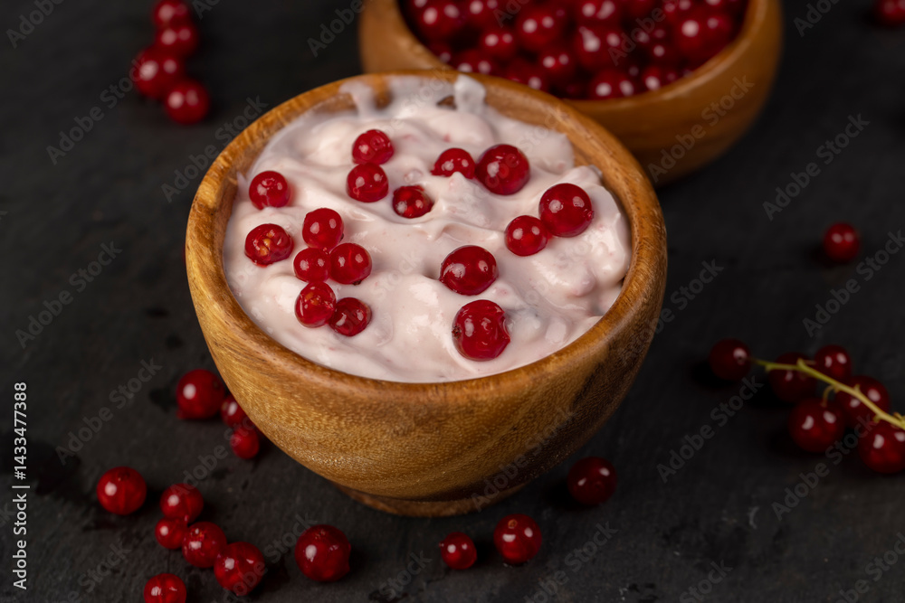 milk product made from milk with the addition of red sweet and sour currants and currant flavor, side view