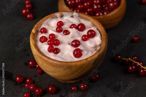 Obraz na płótnie milk product made from milk with the addition of red sweet and sour currants and currant flavor, side view w salonie