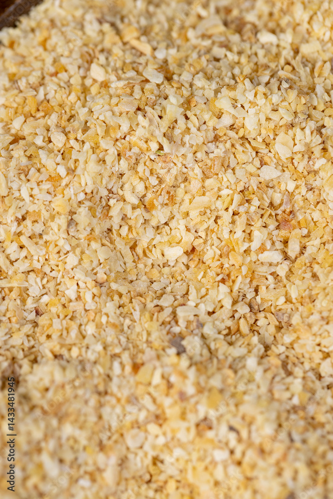 dried garlic for cooking closeup, dried spices from very small pieces of garlic fruits, dehydrated