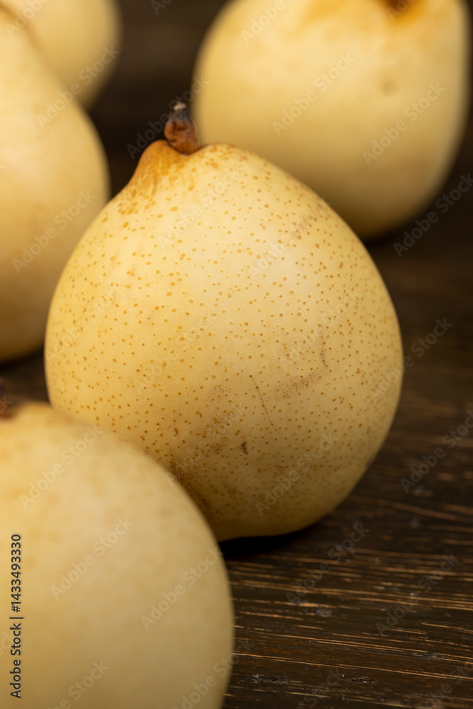 clean pears with yellow skins with small spots, closeup