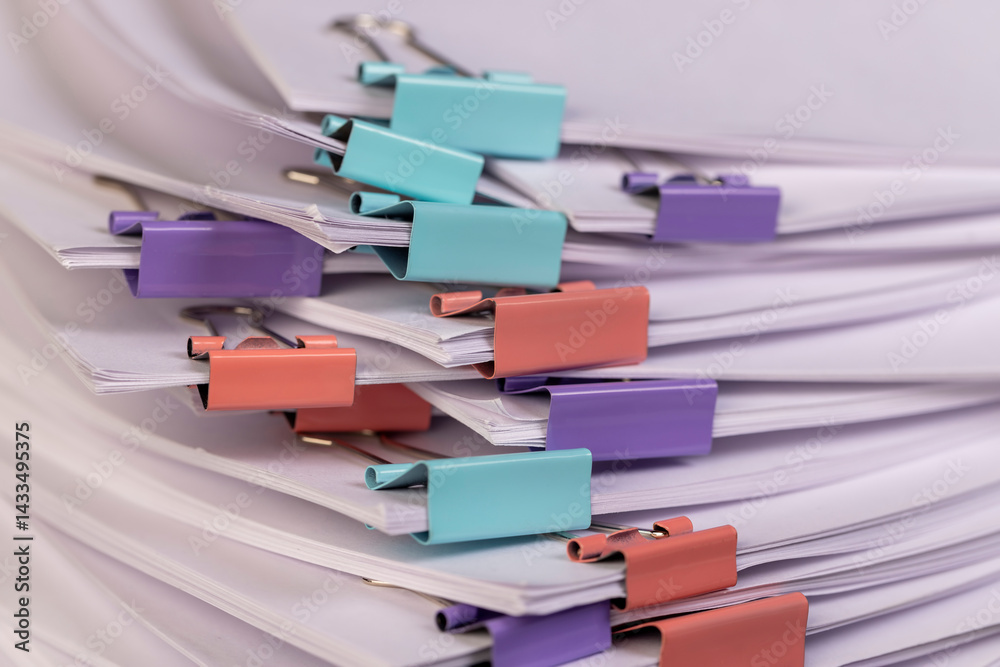 paper are connected by multicolored metal clips, stacked sheets of paper for documents are joined together, the number of sheets of paper is different in each clip