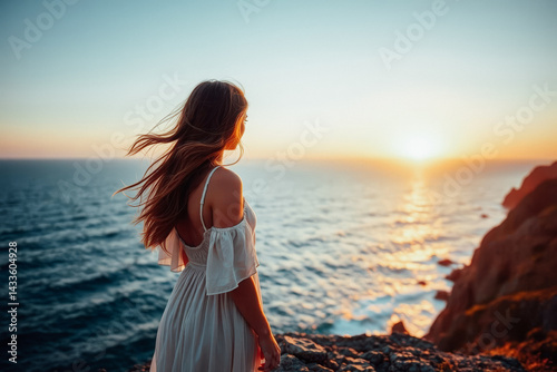 Woman Contemplating Sunset Over Ocean
