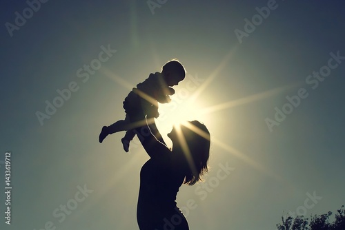 Silhouette of a mother holding her baby with a radiant sun glowing behind them, symbolizing love, warmth, and new beginnings.

