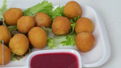 Wallpaper Mural Frying dough balls in oil, street food vendor preparing delicious snack in Wuzhen, China Torontodigital.ca