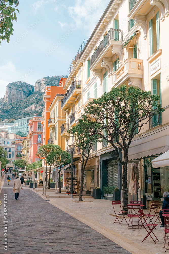 Fototapeta premium Colorful Pedestrian Street with Cafés and Shops in a Mediterranean Town