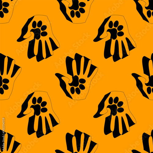 Seamless vector pattern showing human hands merged with animal paw prints in black on an orange background. Ideal for pet care, adoption, or wildlife support themes and designs.