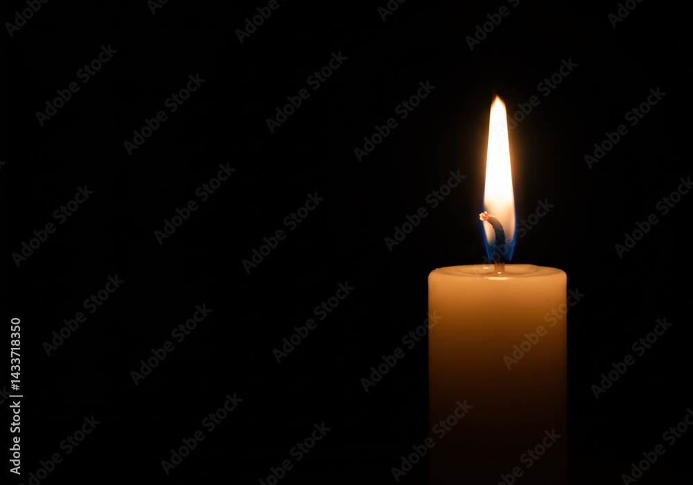 A close-up captures a candle flame dancing against a deep black backdrop, radiating warmth. A close-up captures a candle flame dancing against a deep black backdrop, radiating warmth.