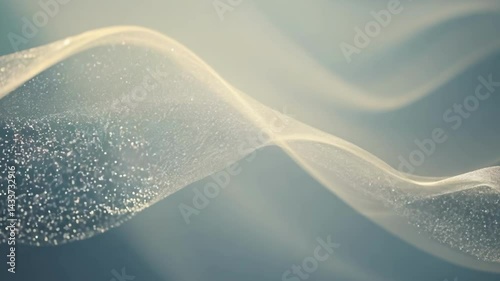 Elegant white smoke-like waves flowing smoothly against blue background. Ethereal wisps gradually transform and expand, creating delicate abstract patterns with flowing movement and soft transitions.