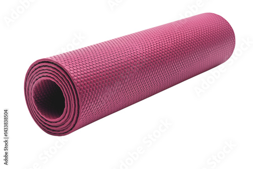 A rolled up pink yoga mat with a textured surface is lying on a dark surface in a studio setting png