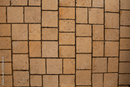 Paving surface. Orange square tiles texture. Stone street road - paving texture effect
