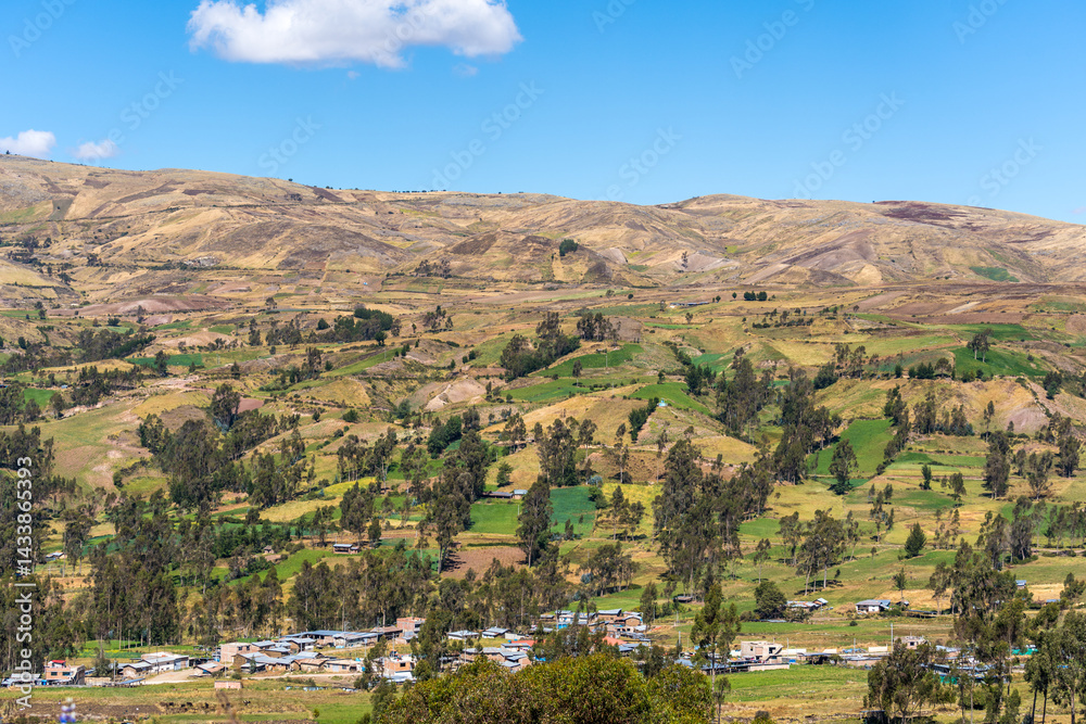 Obraz premium MOUNTAIN RURAL LANDSCAPE WITH PATCHWORK FIELDS AND VILLAGE..