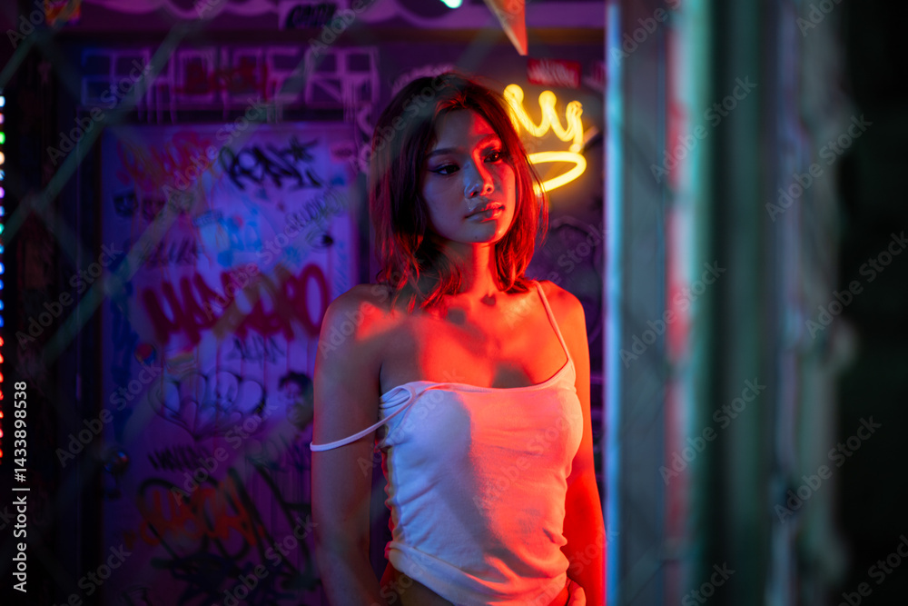 Fototapeta premium Asian young models pose for photoshoots, Women with the brilliant city lights theme