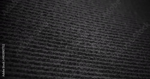 Dark Linear Textured Surface in Motion. Video showcasing a dark surface with fine linear patterns and smooth camera movement, perfect for minimalist backgrounds and design projects.