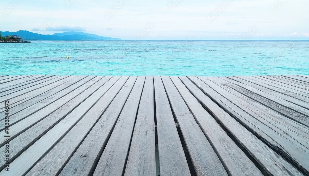 Tranquil wooden dock overlooking turquoise ocean Tranquil wooden dock overlooking turquoise ocean