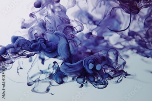 Obraz na płótnie Fluid purple ink dissolving and swirling in water, creating a mesmerizing abstract pattern against a light background w salonie