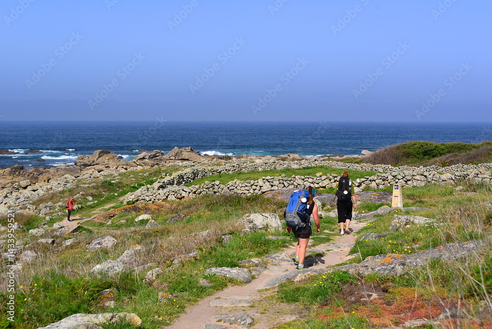Φωτογραφία Three young women pilgrims of Compostela on the Portuguese Camino de Santiago