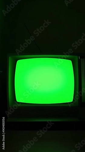 A vintage green screen TV set against a retro-inspired background, artistically generated by AI to evoke nostalgic vibes Vertical 9 16..