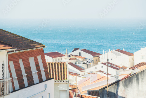 Obraz na płótnie Traditional architecture with red tile roofs on the coast of Atlantic ocean in Nazare, Portugal. w salonie