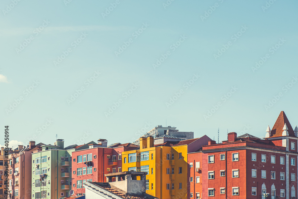 Colorful architecture in Lisbon, Portugal. Red and yellow houses and the blue sky at sunny day.