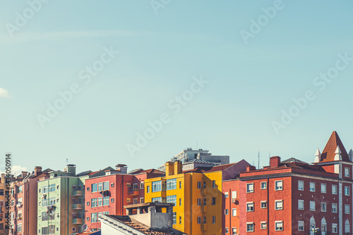 Obraz na płótnie Colorful architecture in Lisbon, Portugal. Red and yellow houses and the blue sky at sunny day. w salonie