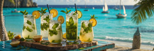 Obraz na płótnie Mojito cocktails on a table against the backdrop of a stunning seascape in Cuba w salonie