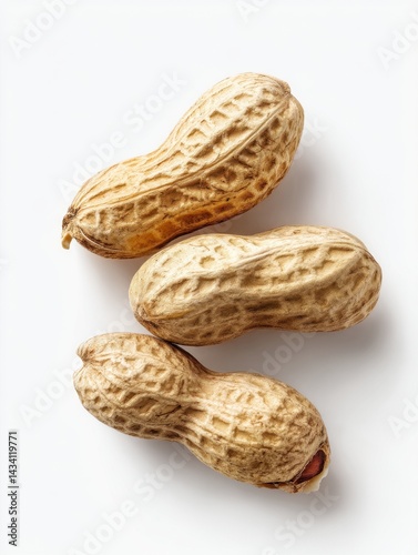 Captivating studio shot of three peanuts in their shells arranged vertically on a white background showcasing their texture and form for healthy eating concept photo